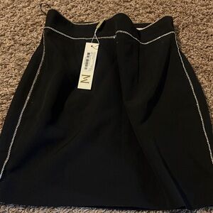 Meshki Black Mini Skirt with diamond like detailing